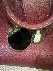 BVLGARI Chic Maroon Handbag with Snake Charm