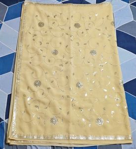 Elegant Cream Saree with Silver Embellishments