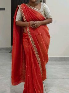 Orange Pure Tissue Embroidered saree