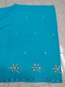 Turquoise Saree with Floral Embellishments