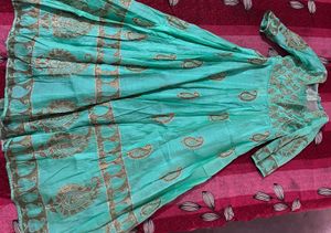 Beautiful Teal Ethnic Gown with Gold Print know an