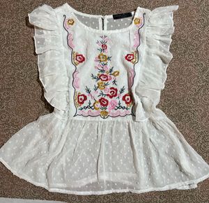 Embroidered White Peplum Top