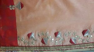 Elegant Peach Saree with Red Border