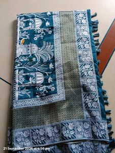 Elegant Teal Saree with Intricate Designs