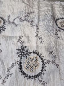 Embroidered fabric with solid matching fabri