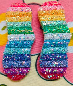 A Pair Of Glittery Rainbow Clips