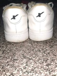 crisp white Sparx sneakers