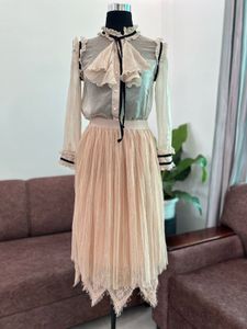 Elegant Pleated Midi Skirt with Lace Trim