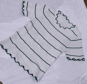 Chic Striped Top with Ruffled Edges