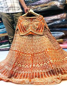 Stunning Orange Embroidered Lehenga Choli