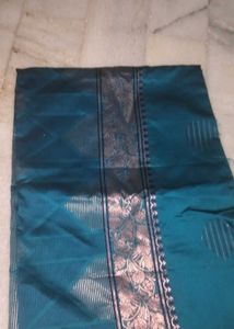 Elegant Teal Saree with Intricate Border