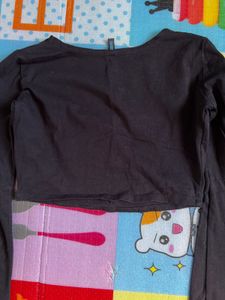 black crop to with long flared sleeves