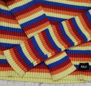 Rainbow Striped Cropped Turtleneck Sweater.