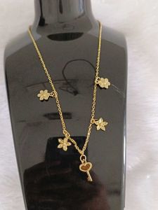 Delicate Gold Flower & Key Necklace