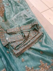 Exquisite Teal Kurta Set with Intricate Embellishm
