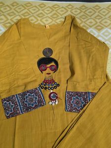 Stylish Mustard Kurta Set with Embellished Necklin
