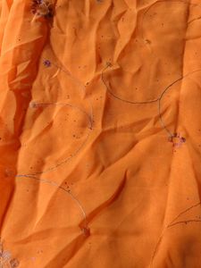 Vibrant Orange Saree with Delicate Floral Motifs