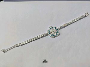 Elegant Pure Silver Rakhi with Blue Stones