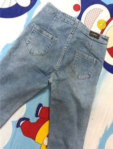 High Weist Light Wash Ripped Jeans
