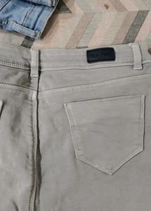 Grey women jeans with light green top