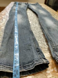 Distressed Blue Denim Jeans