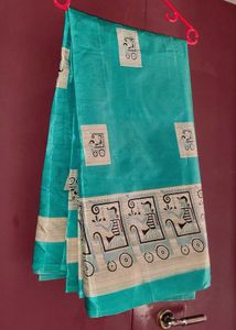 Elegant Teal Silk Saree with Unique Print