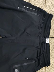 a black solid track pant