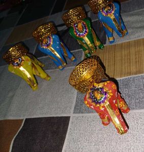 set of five elephants with diya on it