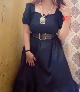 Elegant Black Dress with Statement Necklace