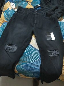 Black Distressed bootcut Jeans with hem