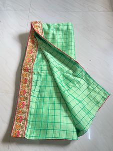 Elegant Green Checked Saree with Floral Border