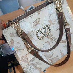 Elegant Floral Handbag with Gold Chain Strap
