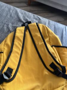 Yellow Backpack with "Escape plan" Text