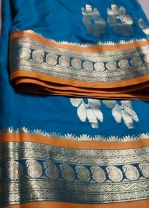 Elegant Teal and Gold Saree