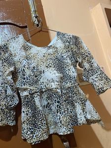 Chic Animal Print Peplum Top