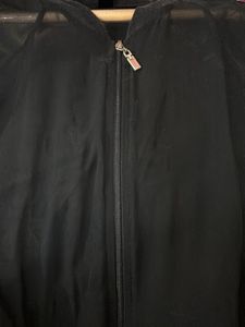 transparent black shrug top with zip