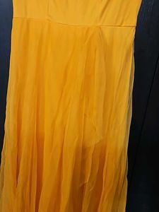 Beautiful Yellow Partywear Gown With Net Pallu