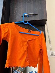 Orange Lettuce Hem Crop Top