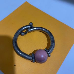 Unique Silver Tone Bangle with Pink Bead Accent