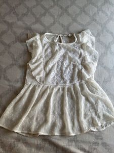 Elegant White Embroidered Peplum Top