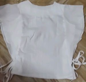 White Top With Shoulder Frill And Knot Style.