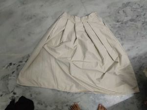 beige pleated skirt