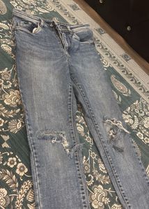 Distressed Blue Denim Jeans