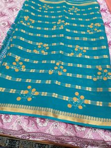 Teal Saree with Gold Border and Embellishments