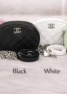 Black Quilted Oval Crossbody Bag