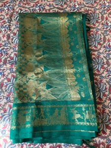 Beautiful Teal Saree with Gold Border