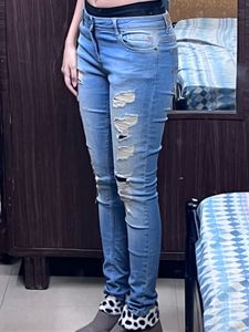 Distressed Light Wash Denim Jeans