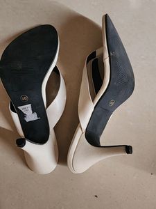 A Pair Of White Heels