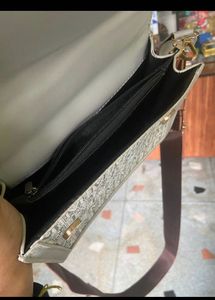Free Delivery: Stylish Grey Handbag with Monogram