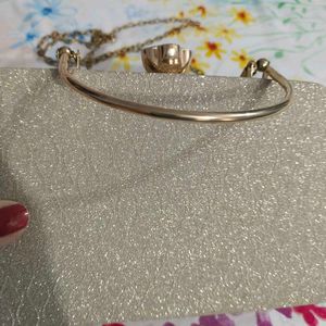 Sparkly Gold Clutch Bag with Gemstone Clasp